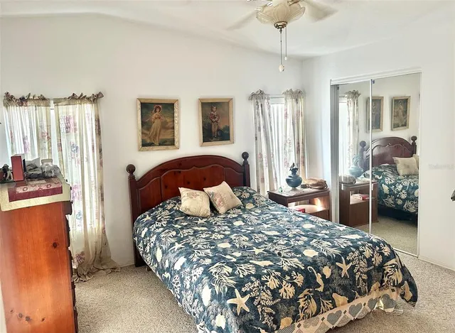 a bedroom with a large bed and a dresser