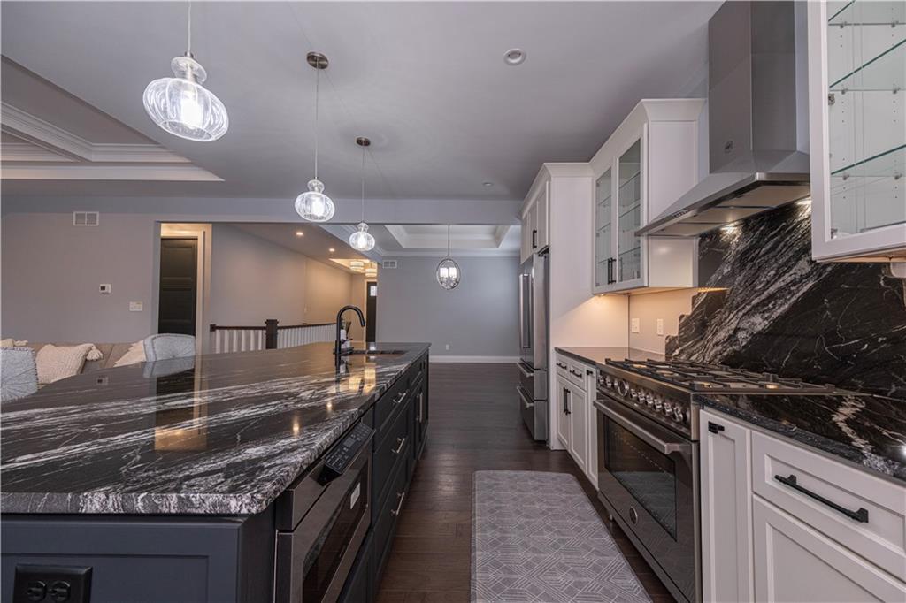 1213 Harrison Court Export, PA 15632 - Photo 12 of 41 a kitchen with stainless steel appliances granite countertop a stove and a sink