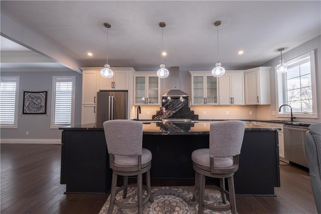 1213 Harrison Court Export, PA 15632 - Photo 16 of 41 a kitchen with a table chairs sink and cabinets