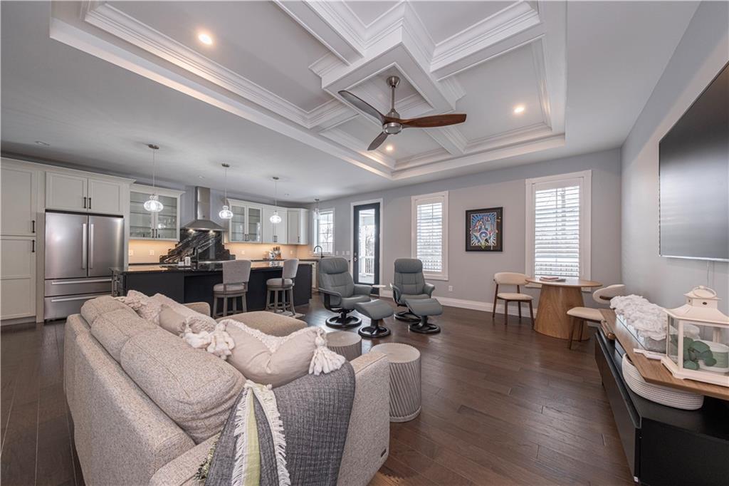 1213 Harrison Court Export, PA 15632 - Photo 20 of 41 a living room with furniture kitchen view and a wooden floor
