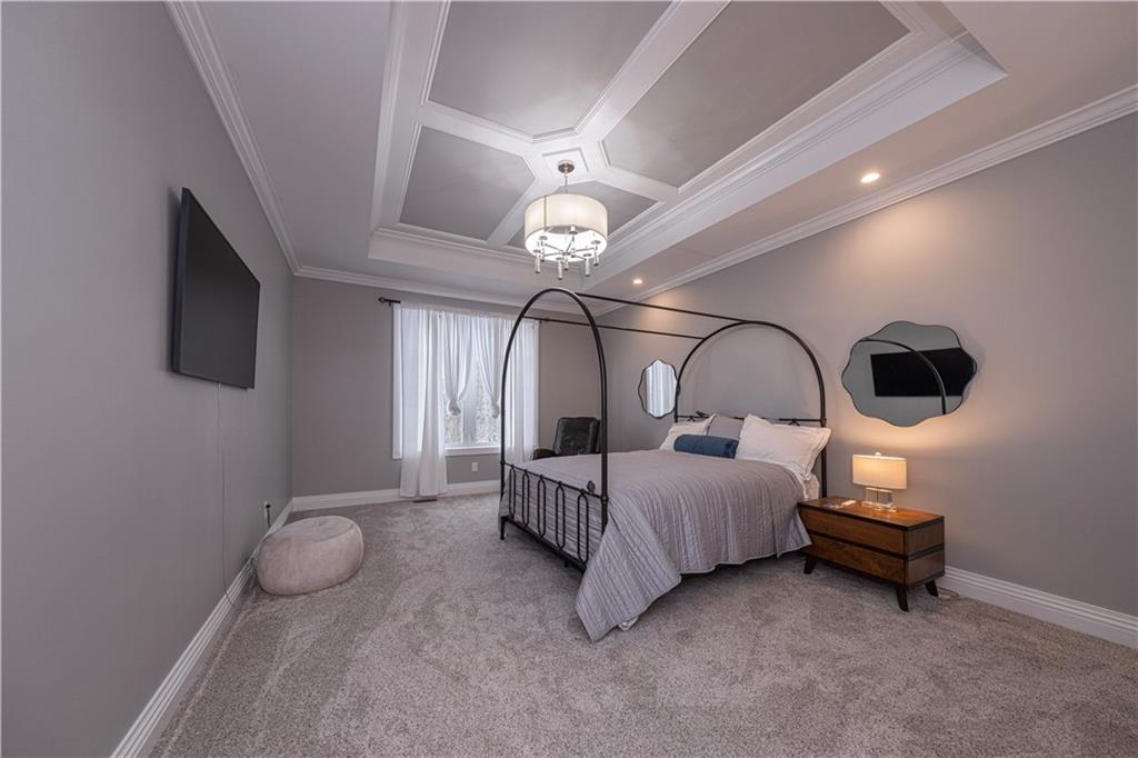 1213 Harrison Court Export, PA 15632 - Photo 21 of 41 a bedroom with a bed and a chandelier