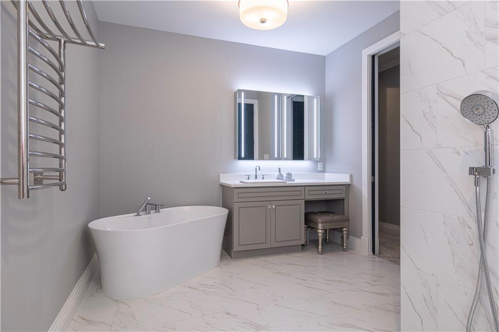 1213 Harrison Court Export, PA 15632 - Photo 25 of 41 a bathroom with a bathtub sink and mirror