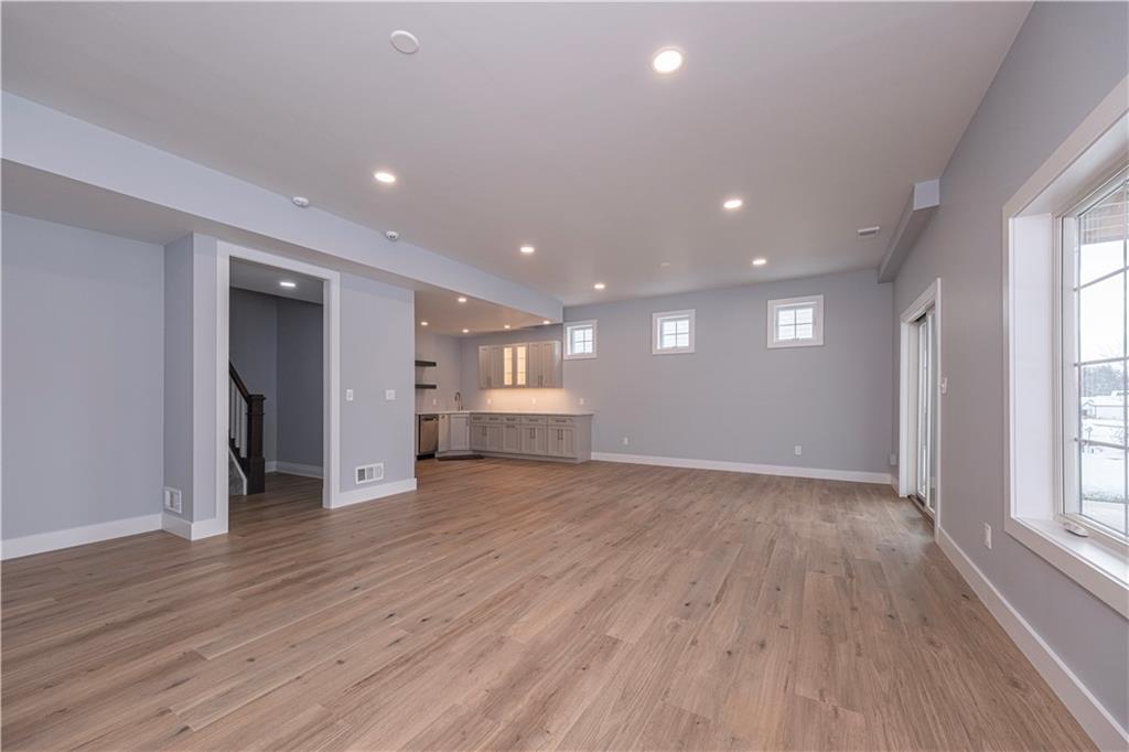 1213 Harrison Court Export, PA 15632 - Photo 29 of 41 an empty room with wooden floor and windows