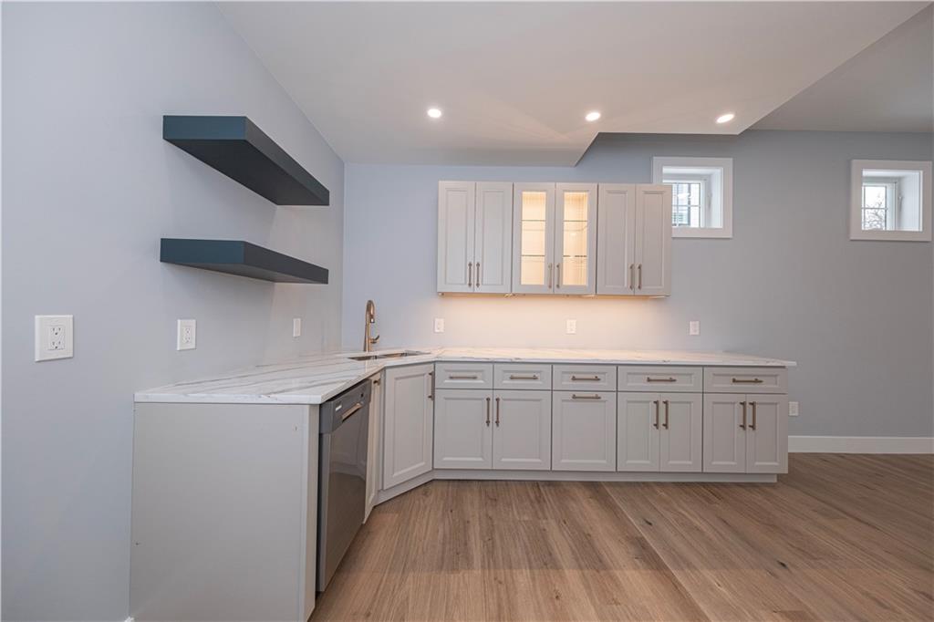 1213 Harrison Court Export, PA 15632 - Photo 32 of 41 a kitchen with granite countertop white cabinets and white appliances