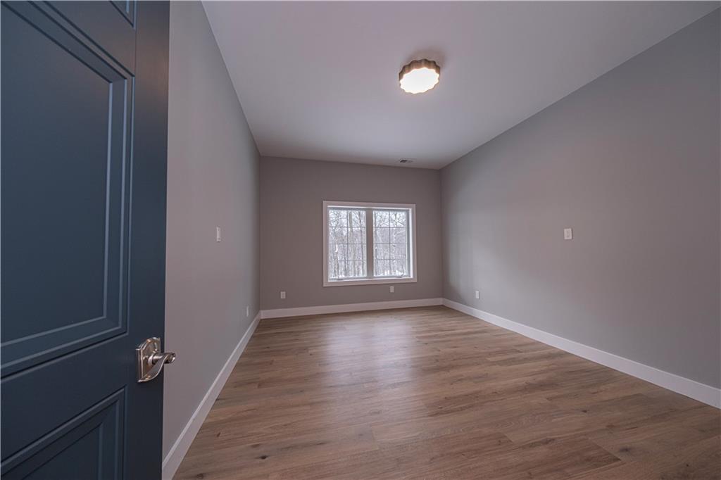 1213 Harrison Court Export, PA 15632 - Photo 34 of 41 wooden floor in an empty room with a window
