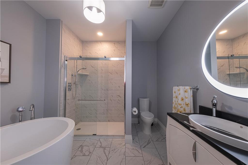 1213 Harrison Court Export, PA 15632 - Photo 6 of 41 a bathroom with a sink a toilet and shower