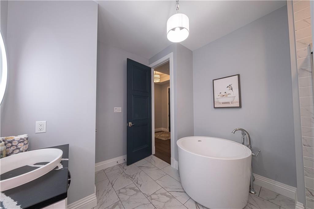 1213 Harrison Court Export, PA 15632 - Photo 7 of 41 a bathroom with a bathtub and shower