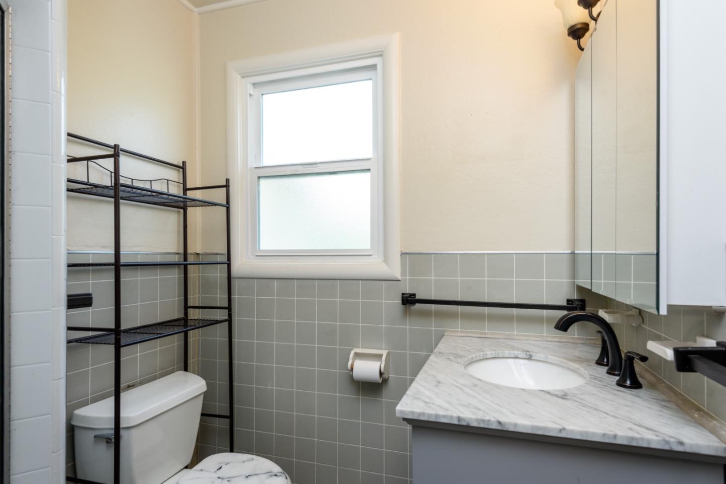 415 Primrose Road Burlingame, CA 94010 - Photo 18 of 23 a bathroom with a sink toilet and shower