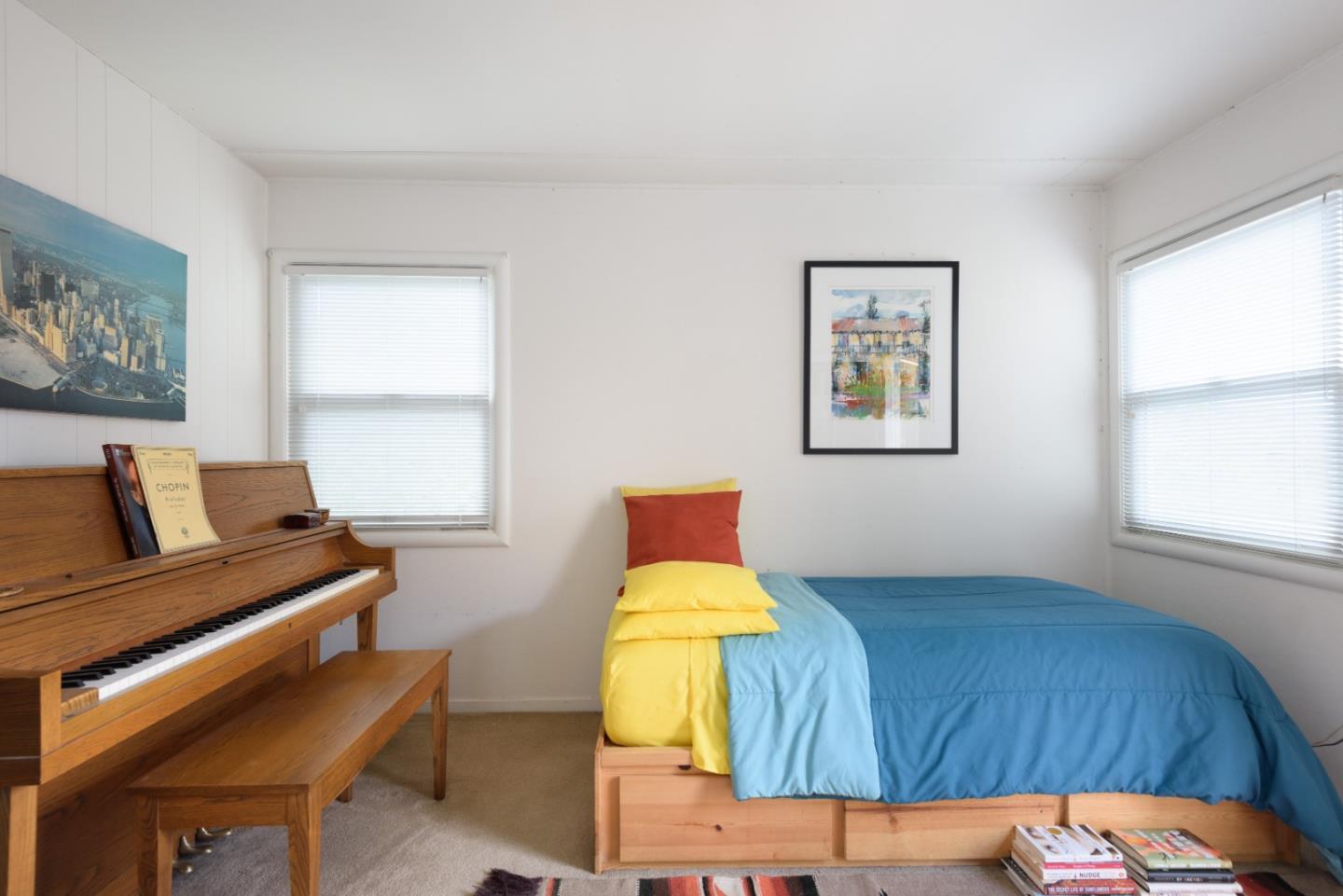 415 Primrose Road Burlingame, CA 94010 - Photo 22 of 23 a bedroom with a bed and wooden floor