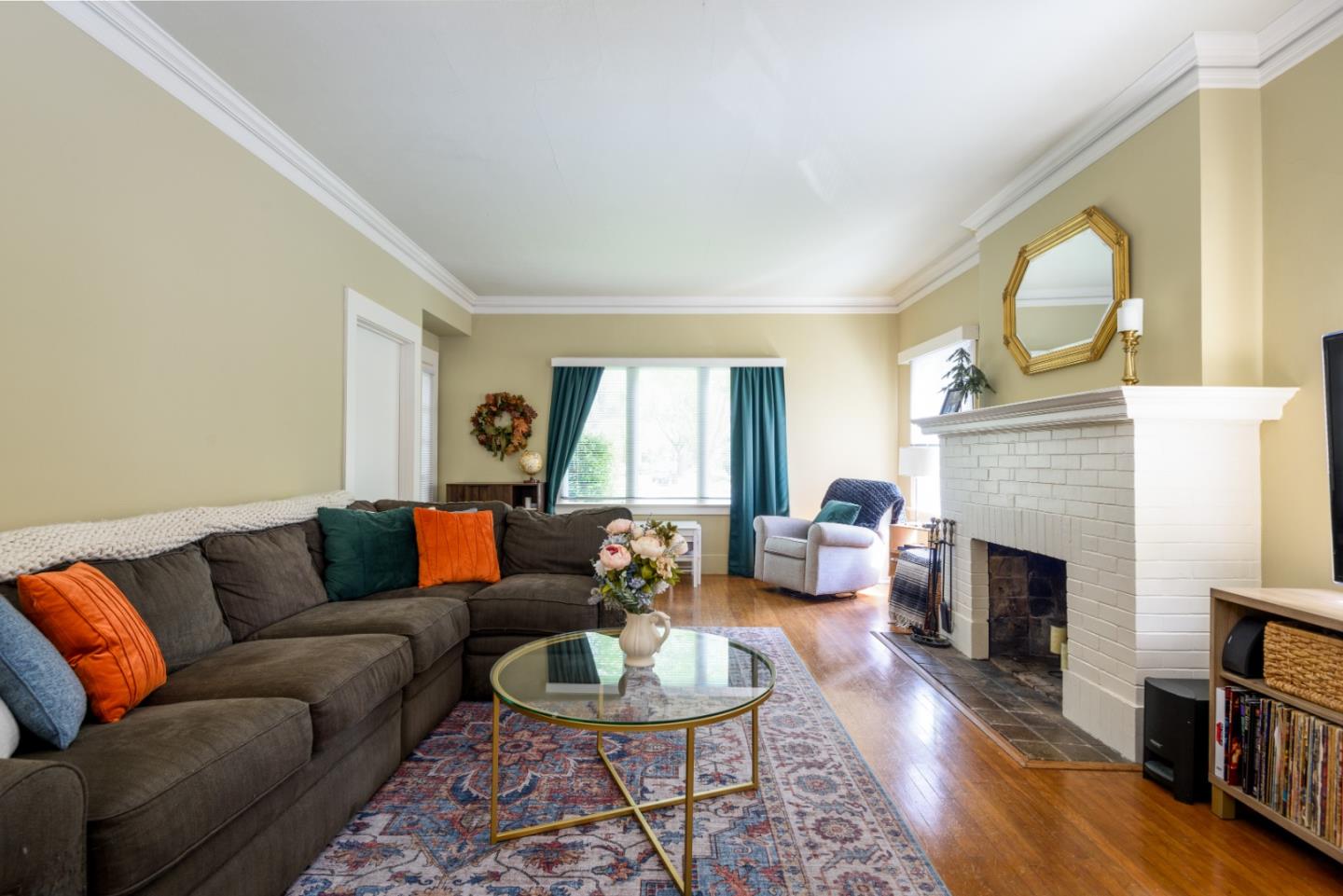 415 Primrose Road Burlingame, CA 94010 - Photo 3 of 23 a living room with fireplace furniture and a wooden floor