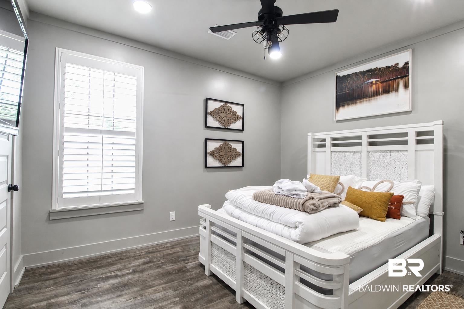 9825 Wolf Creek Ridge Elberta, AL 36530 - Photo 7 of 76 Spacious room featuring wood-finish flooring, a ceiling fan with light fixture, recessed lighting, crown molding, and a window with plantation shutters