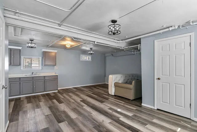 a room with natural light and wooden floor