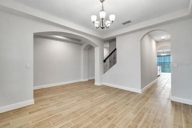 a view of a livingroom with wooden floor