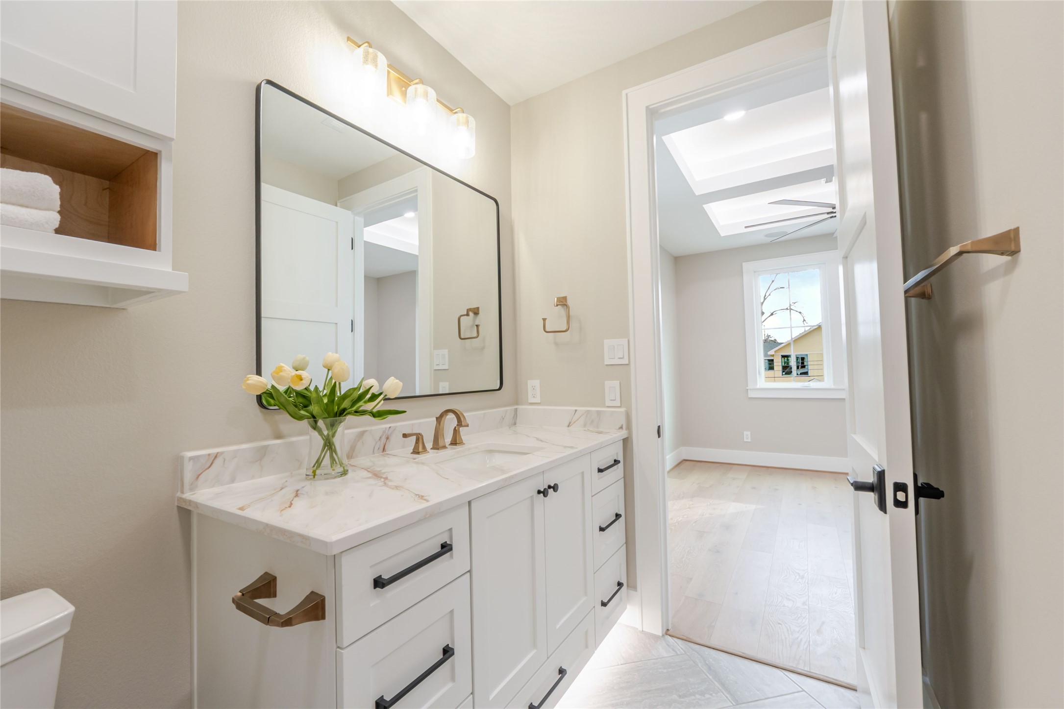 3100 Garwood Street Austin, TX 78702 - Photo 22 of 35 Half bath with vanity and a skylight
