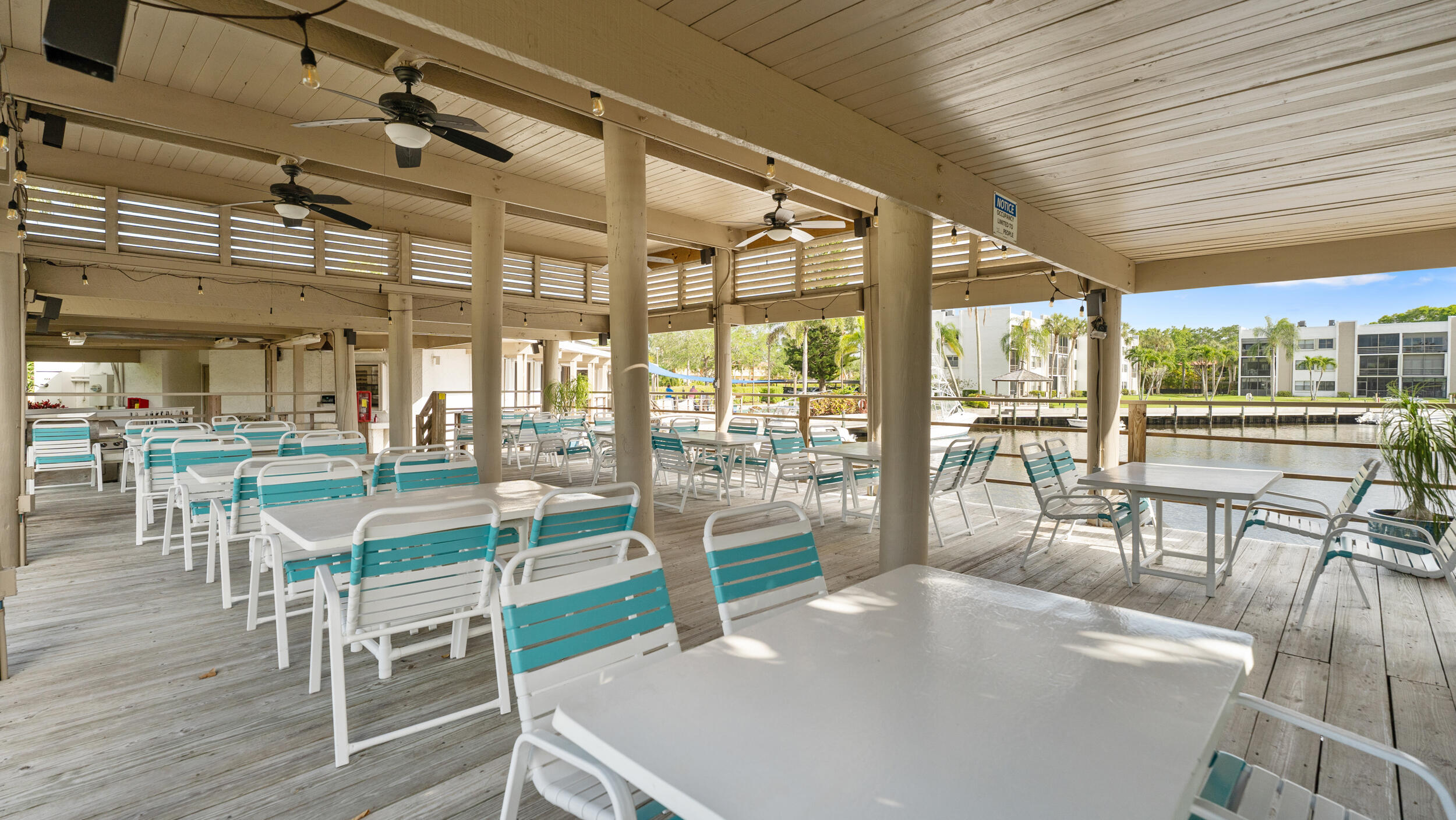 1950 Southwest Palm City Road, Unit 8302 Stuart, FL 34994 - Photo 28 of 41 20_clubhouse patio