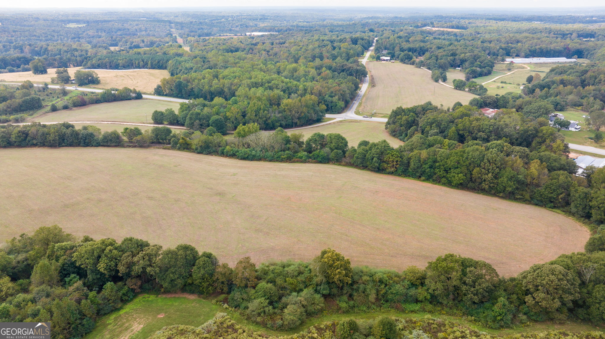 120 Hunnicutt Circle Canon, GA 30520 - Photo 19 of 30 an aerial view of a house with a garden and lake view