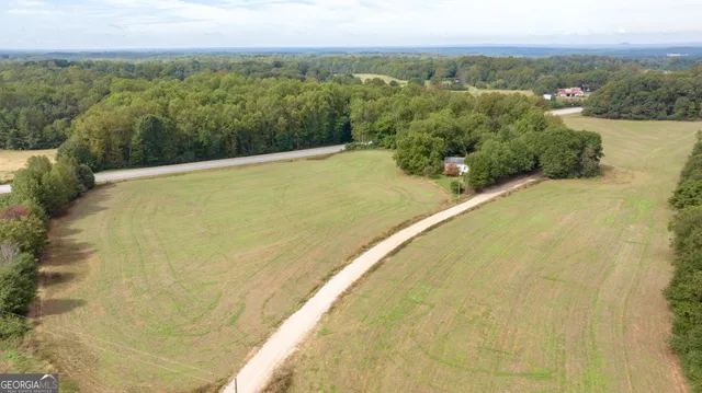 a view of a swimming pool and mountains in the background
