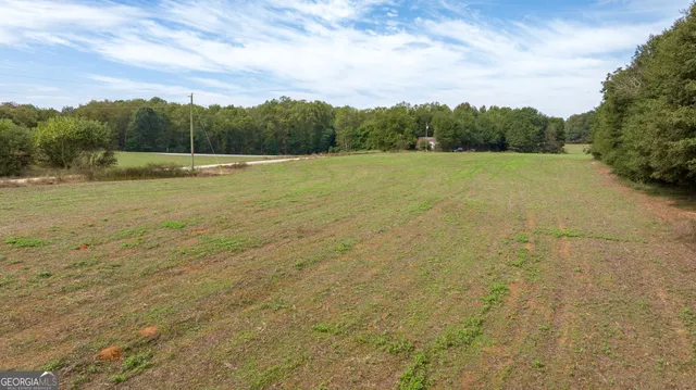 a view of a field with an outdoor space