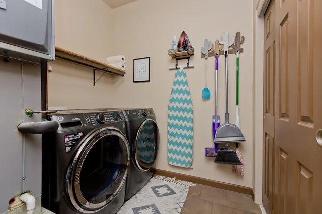 a view of a hallway with washer and dryer