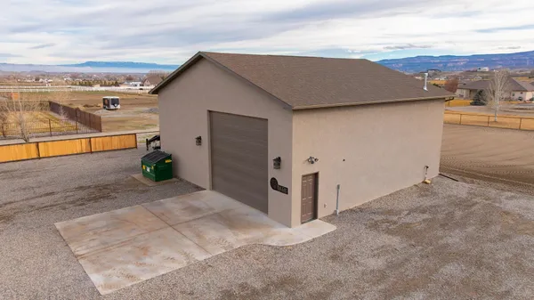 an outdoor view of house with backyard
