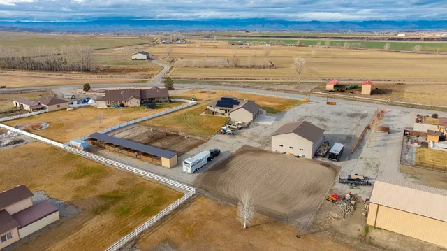 an aerial view of a pool table and chairs