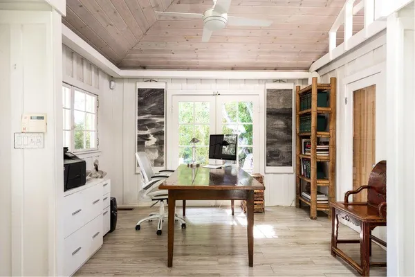 a workspace with furniture window and outside view