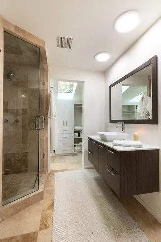 a bathroom with a sink and a mirror