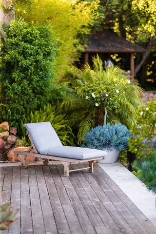 a view of a backyard of a house