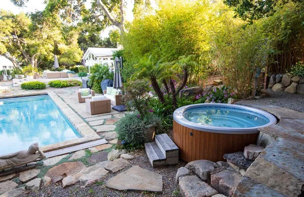 a view of a patio with couches and a fire pit