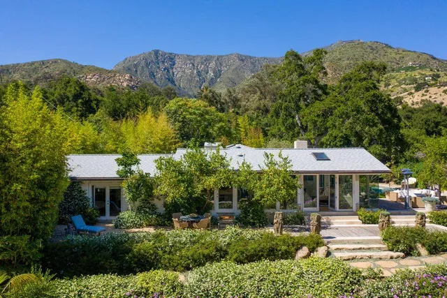 a house view with a garden space