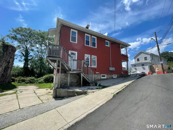 a front view of a house with yard