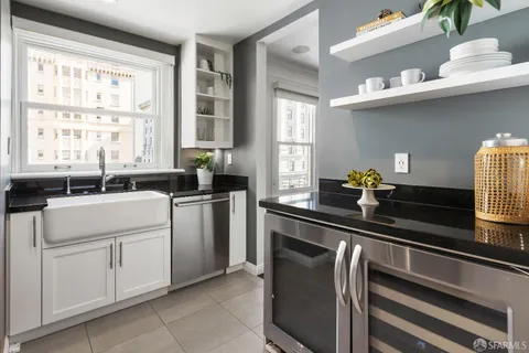 a kitchen with a sink cabinets and window
