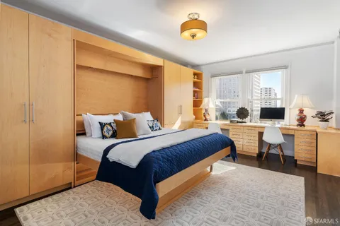 a bedroom with a bed and a couch