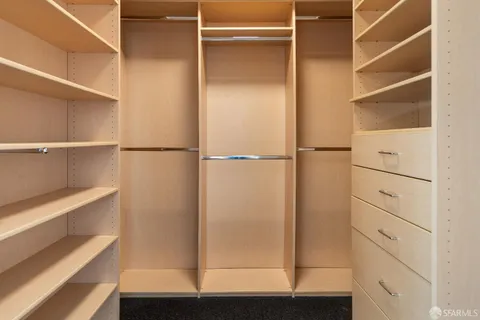 a view of an empty walk in closet