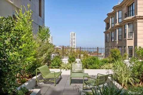 a view of a building with outdoor space and sitting space