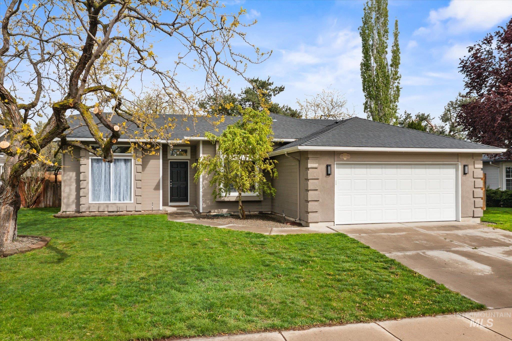 2250 North Amethyst Avenue Meridian, ID 83646 - Photo 48 of 50 Ranch-style home with driveway, an attached garage, and a shingled roof
