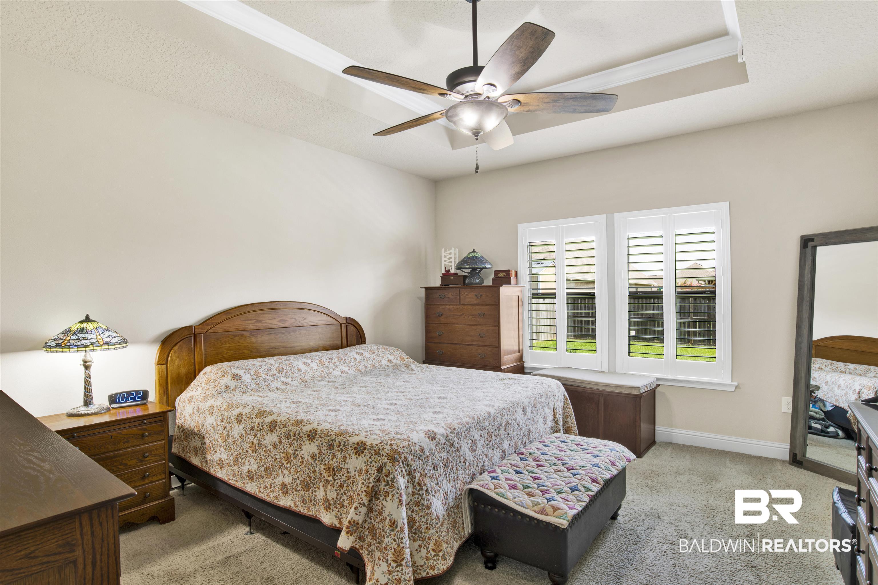 278 Silo Loop Fairhope, AL 36532 - Photo 10 of 26 Bedroom with light carpet, a ceiling fan, and crown molding