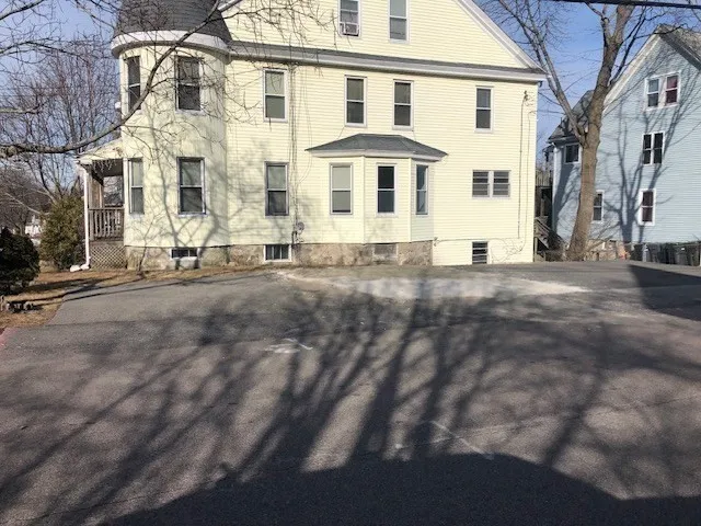 a view of a building with a street
