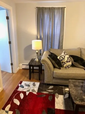 a bedroom with bed and a window