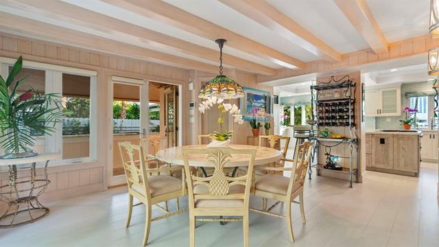 a bedroom with two beds and a large window with outer view
