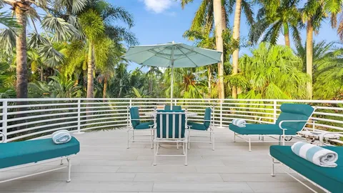 a kitchen with stainless steel appliances granite countertop a barbecue grill and a fireplace