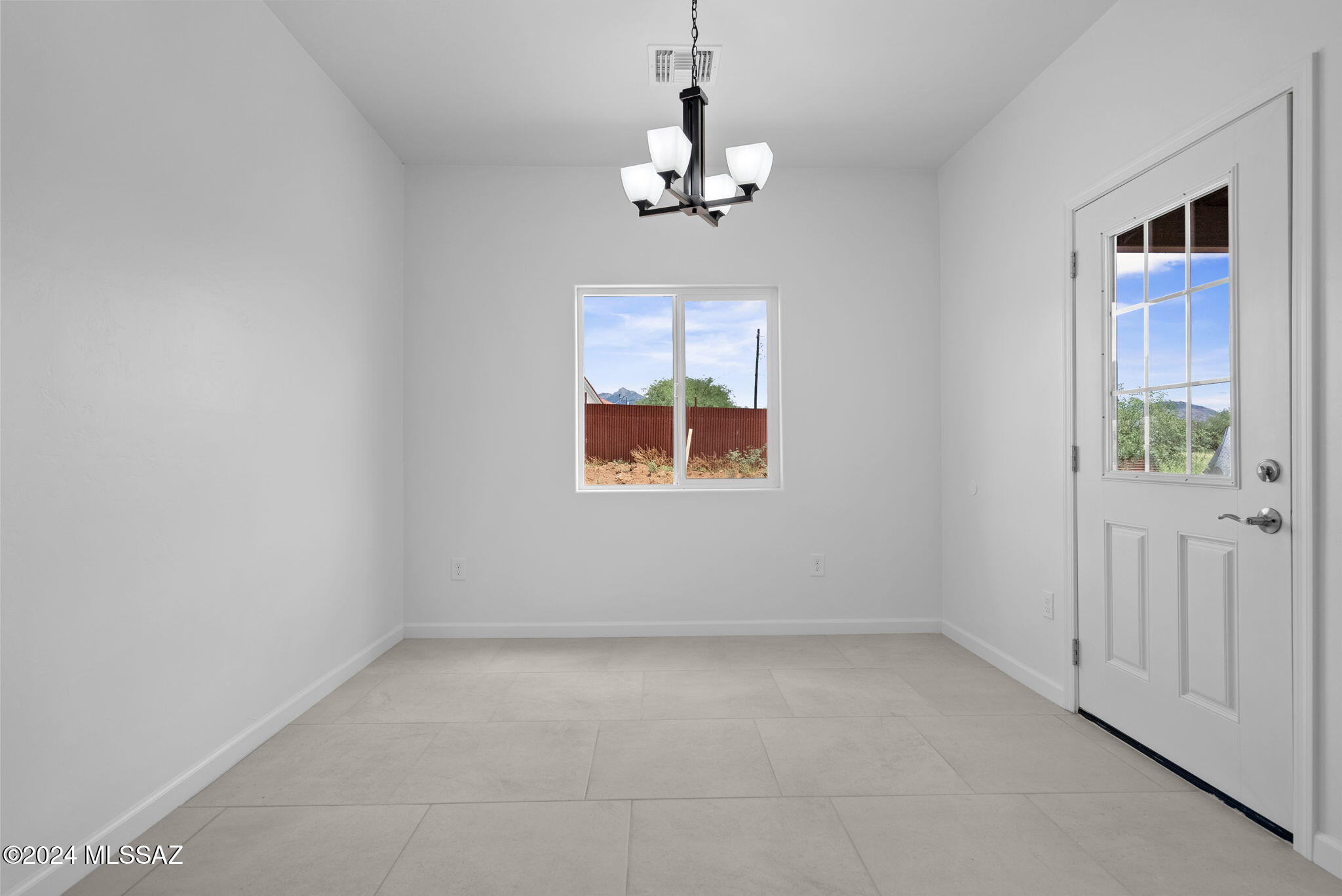 1835 America Court Rio Rico, AZ 85648 - Photo 12 of 35 an empty room that has a window in it