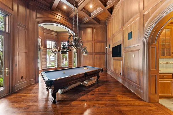 a view of an empty room with a fireplace and a window