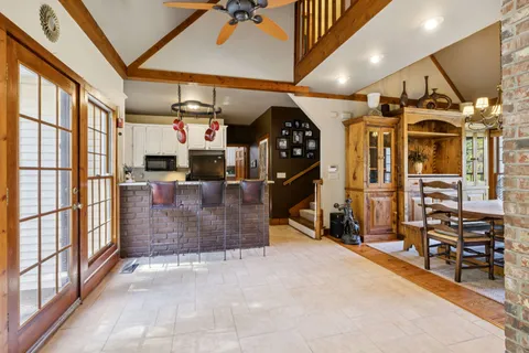 a view of a livingroom with furniture and a ceiling fan
