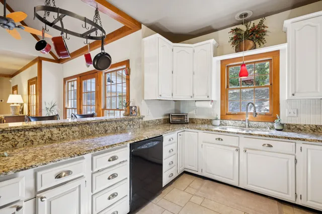 a bedroom with furniture and a window