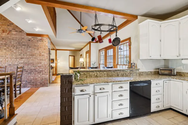 a bed room with a bed and a chandelier