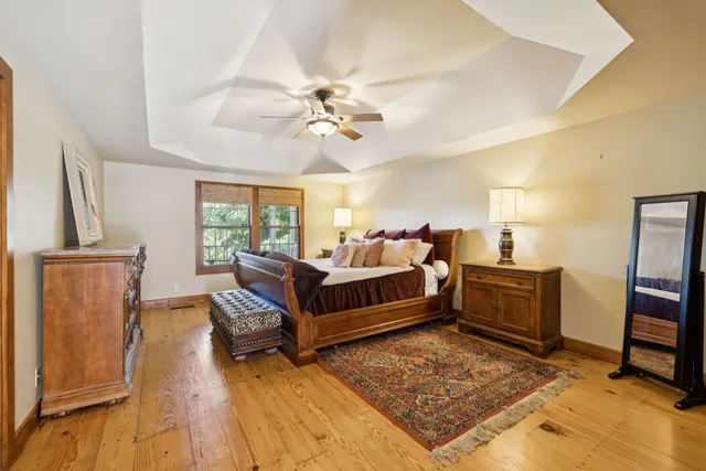 a bedroom with a bed and a lamp