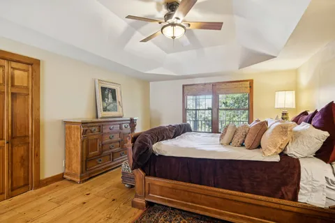 a bedroom with a bed and a lamp