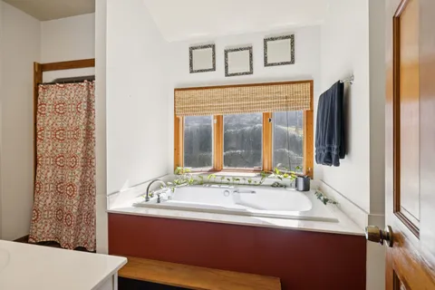 a kitchen with a sink and large window