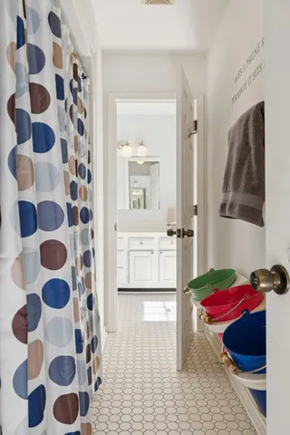 a bathroom with a sink a toilet and mirror